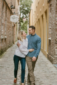 couple walking holding hands in Charleston, SC