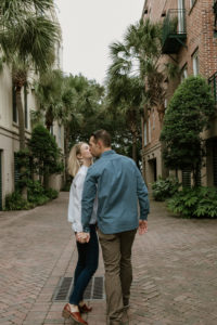 couple walking holding hands in Charleston, SC