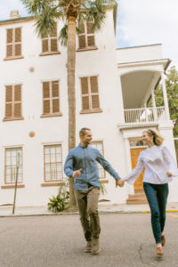 couple walking holding hands in Charleston, SC