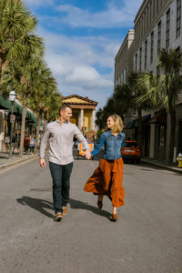 couple walking holding hands in Charleston, SC