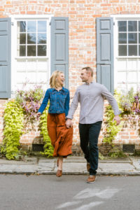 couple walking holding hands in Charleston, SC