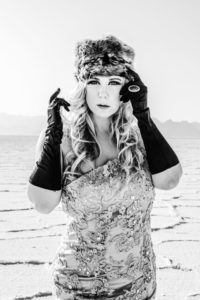 beautiful model in gown dancing on the salt flats