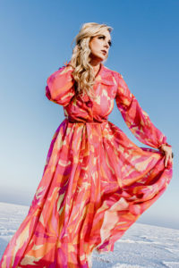 beautiful model in gown dancing on the salt flats