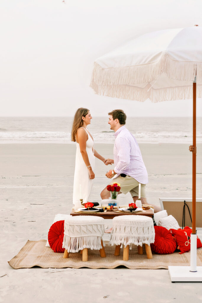 Marriage proposal on the beach in Hilton Head with a picnic set up