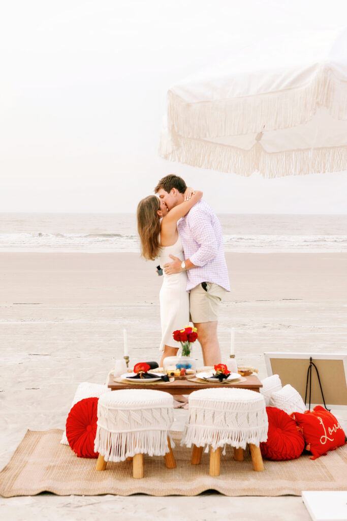 Marriage proposal on the beach in Hilton Head with a picnic set up