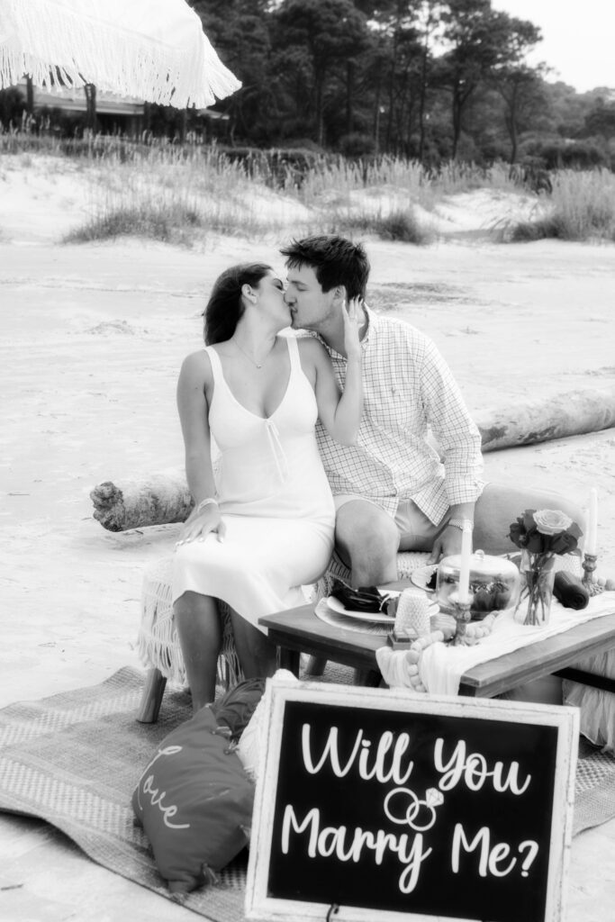 Marriage proposal photography on the beach in Hilton Head with a picnic set up