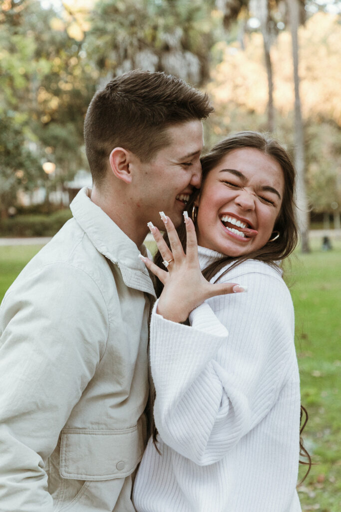 Marriage proposal capture by photographer Lisa Staff with picnic set up at Forsyth Park, Savannah