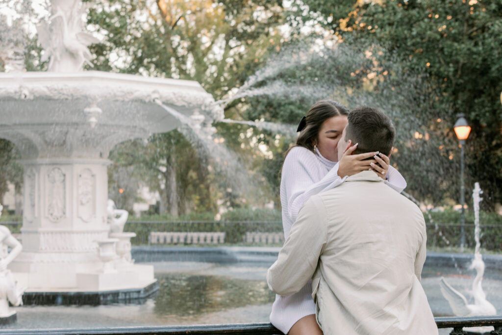 Marriage proposal capture by photographer Lisa Staff with picnic set up at Forsyth Park, Savannah