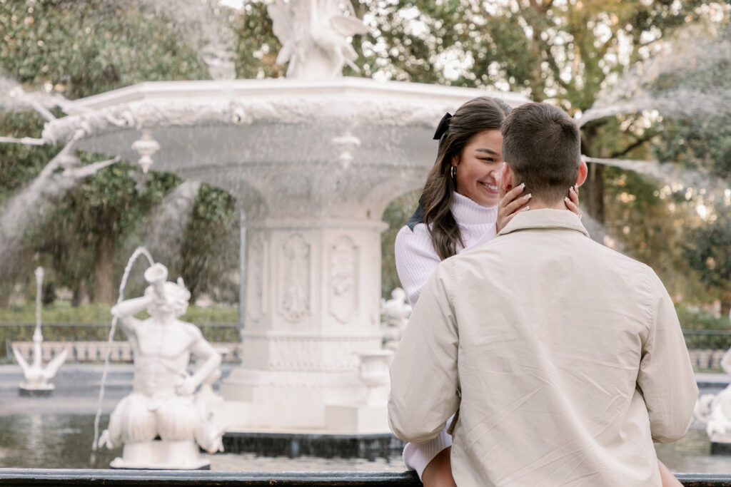 Marriage proposal capture by photographer Lisa Staff with picnic set up at Forsyth Park, Savannah