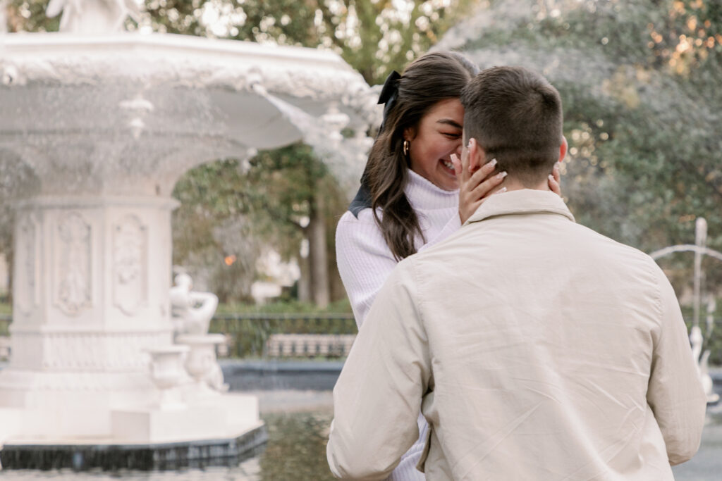 Marriage proposal capture by photographer Lisa Staff with picnic set up at Forsyth Park, Savannah