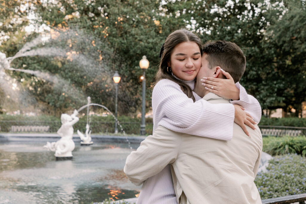 Marriage proposal capture by photographer Lisa Staff with picnic set up at Forsyth Park, Savannah