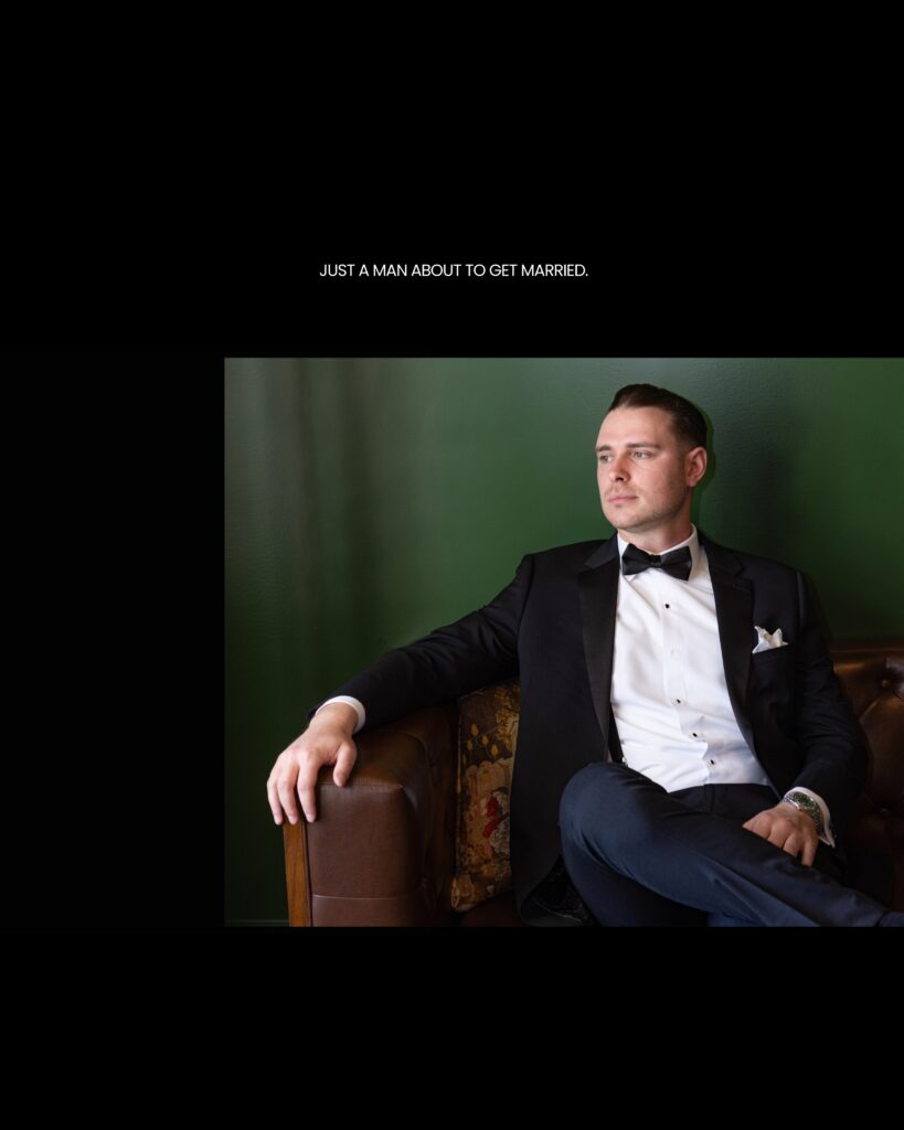 Groom in a tuxedo sitting in a club chair in a cigar lounge at Hewitt Oaks