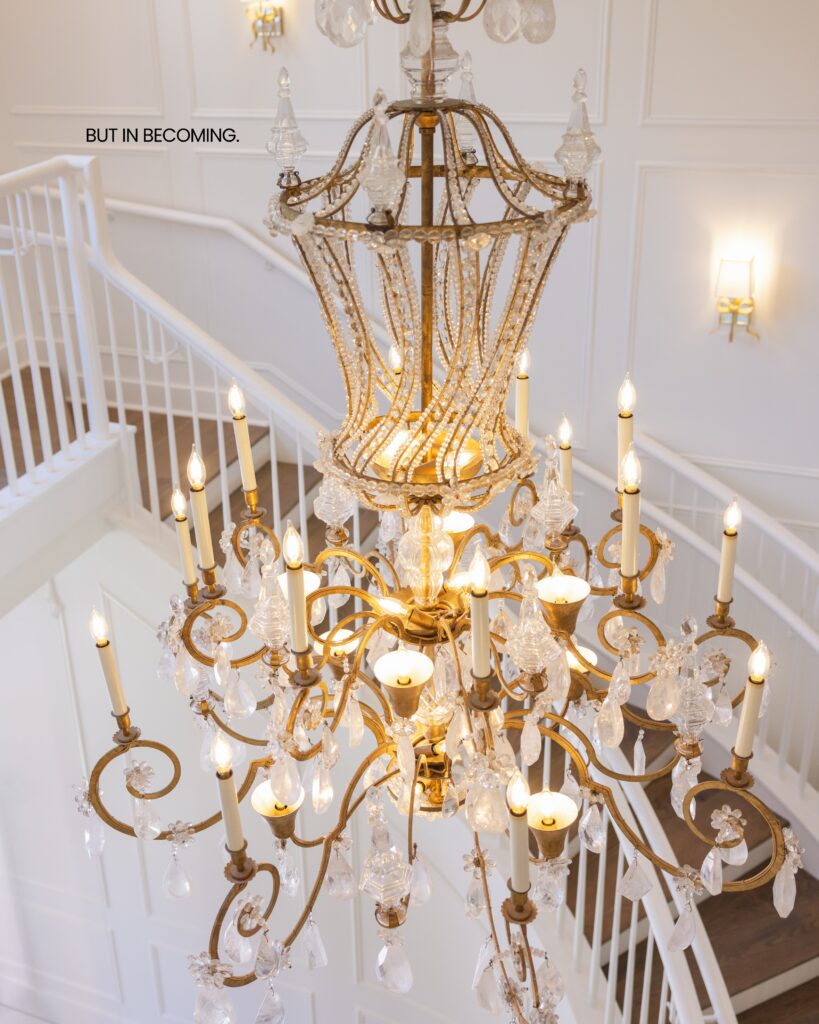 A bride sitting in a beautiful green velvet chair at Hewitt Oaks