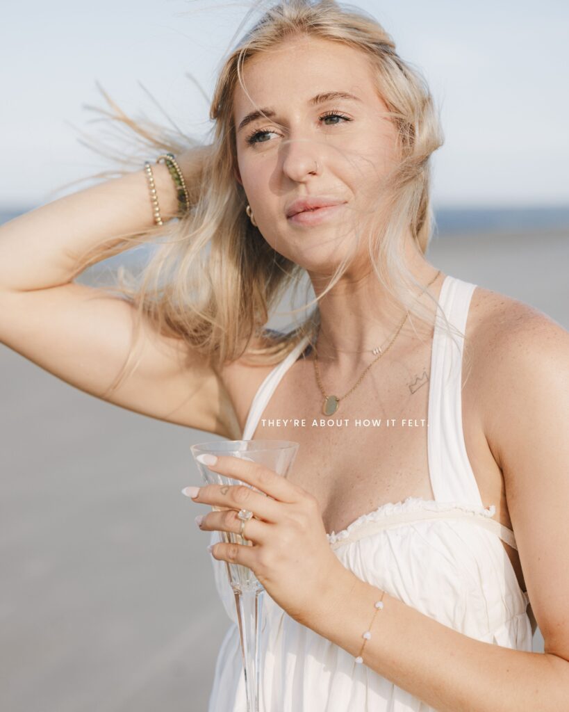 A couple proposes on the beach in Hilton Head on a beautiful sunny day and celebrate with champagne