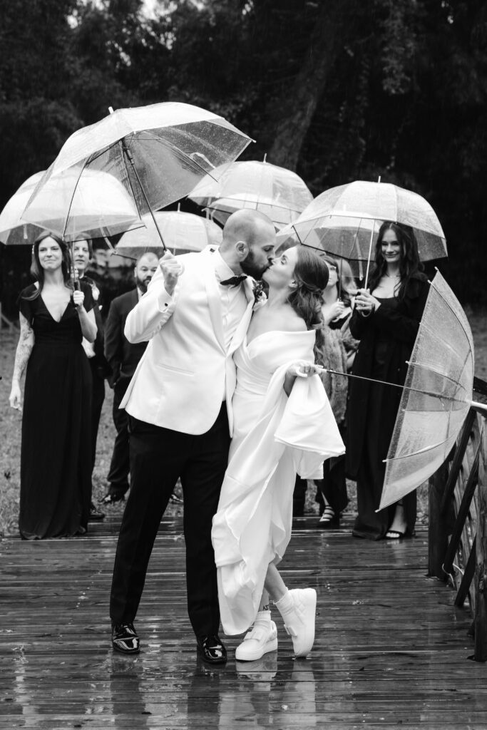 Stunning first look in the rain with the cool couple and their fabulously fun wedding party