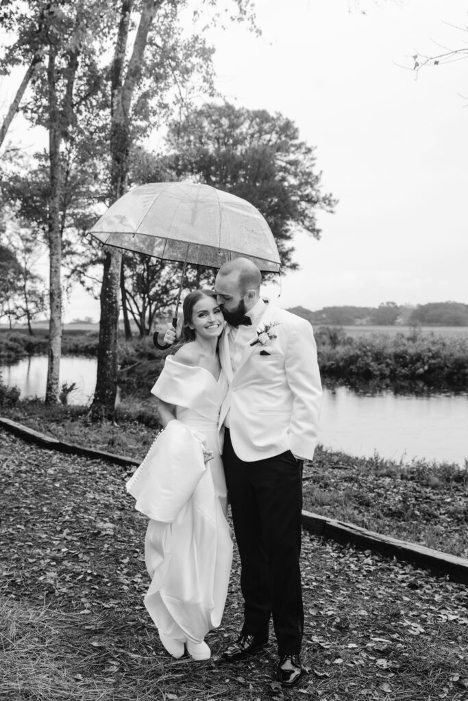 bride and groom getting married under a tent on a rainy wedding day in Hilton Head