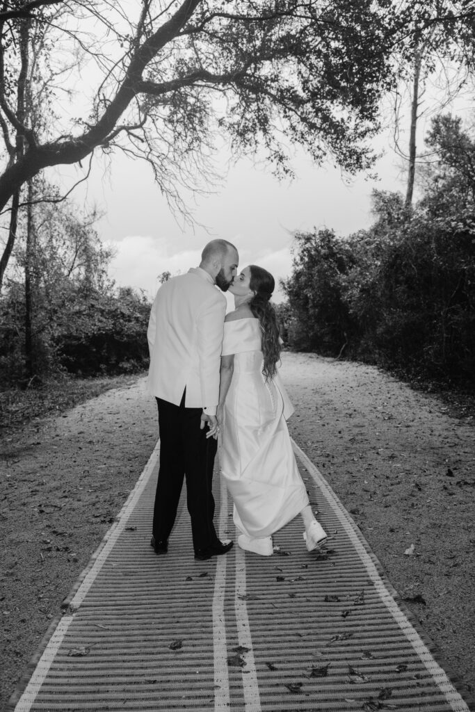 Hugs, spins and kisses from the bride and groom after the ceremony in the rain