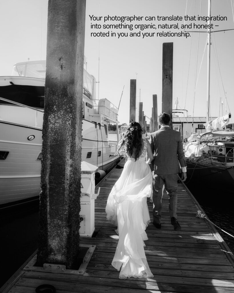 Bride and groom walking down a dock beside their sailboat in Beaufort