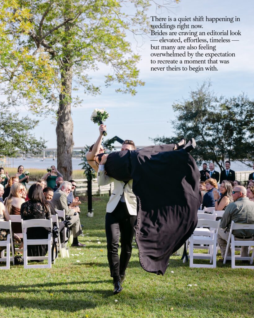 A groom picking up her bride and whisking her when walking down the aisle after the ceremony in Charleston at the waterfront