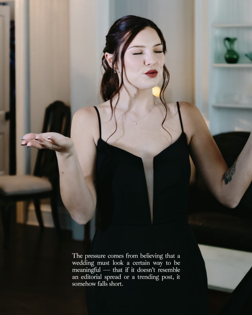 A bride in a black wedding dress exhaling and calming herself